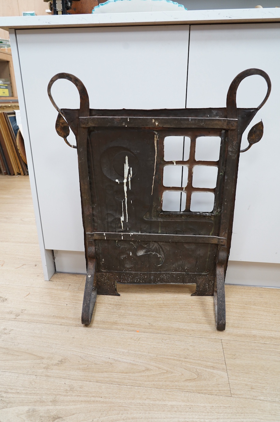 An Arts and Crafts hammered copper and wrought iron fire screen, 73cm. Condition - fair to good, lacking glass panel